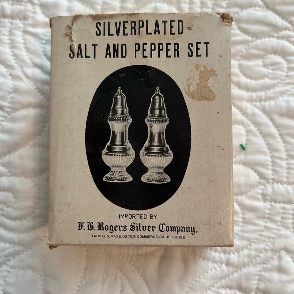 New in original box vintage silver plated salt and paper shakers
